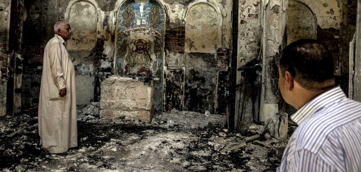 Members of the congregation inspecting the burnt altar of St. John's Church in Assuit, Upper Egypt, on August 19. Photo: Roger Anis