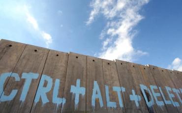 This graffiti on the Israeli separation barrier is from 2007, the restrictions on the freedom of movement for Palestinians however persist until today. Photo: Filippo Minelli/Flickr (CC BY-NC-ND 2.0)