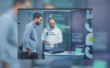 Mohamed Boumaiza at the Tunisian book fair 2025 talking to a customer. Photo: private.
