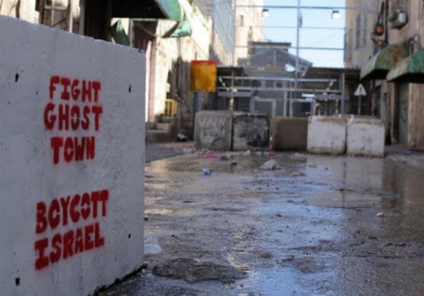 Graffiti in the H1 zone, in front of an Israeli checkpoint leading to the H2 zone. Photo: Izzat Karaki